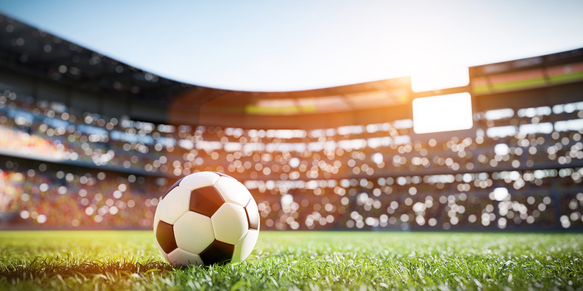 Alt-Text	Fußball auf dem Rasen in einem Stadion